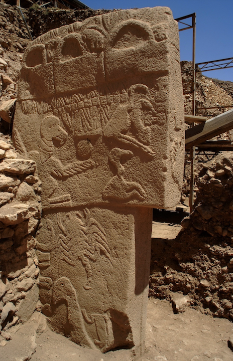  Impressive limestone pillar decorated on three sides with reliefs of animals, birds and abstract forms.